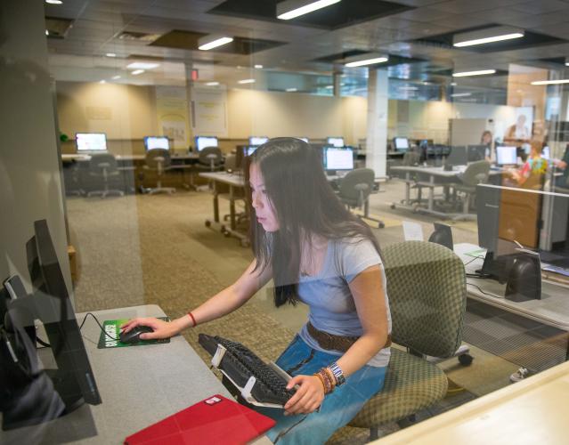 An OHIO student works on a computer.