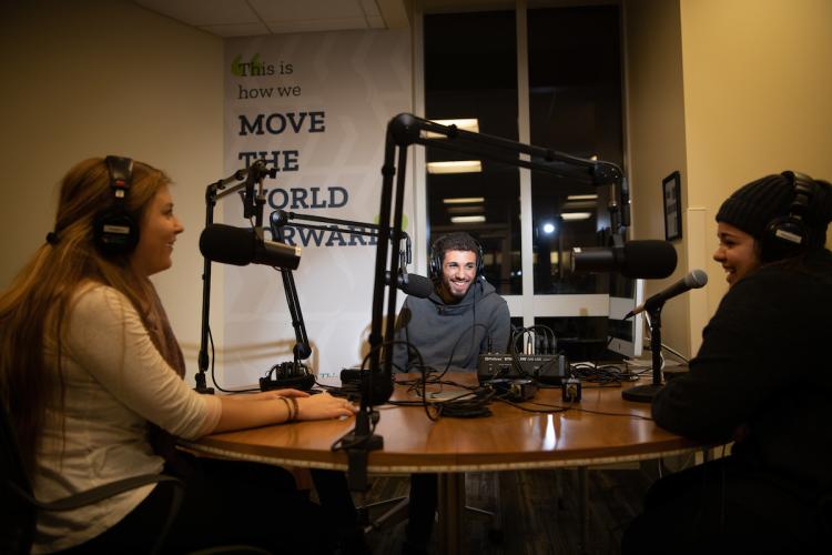 Students making a podcast in studio