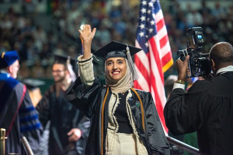 Zamzam AL-Bulushi waves during 2019 commencement