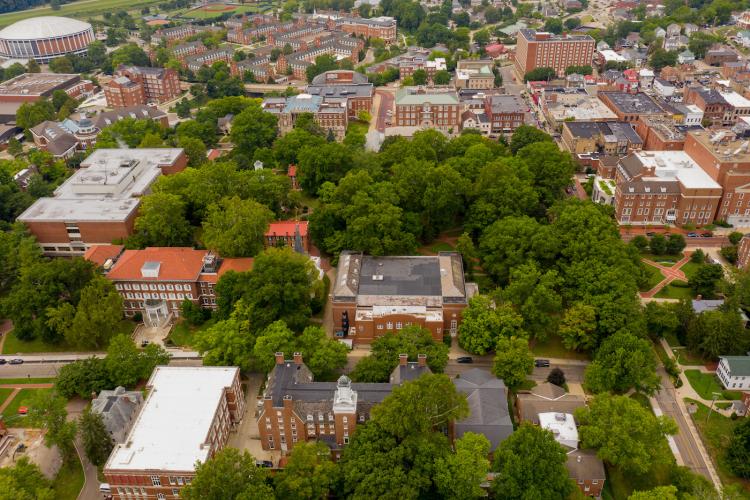 Aerial pictures of campus buildings and trees around College Green, with West Green and the city of Athens in the background as well