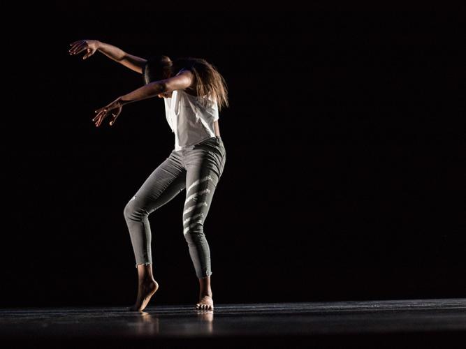 A student dancing on stage