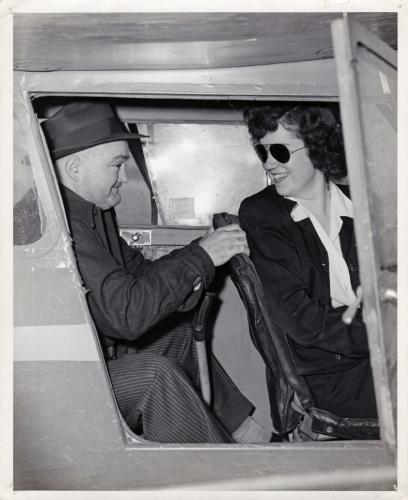 Joan Mace is shown inside an airplane