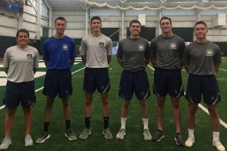 Six Air Force ROTC cadets stand at formation