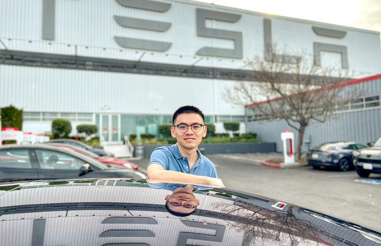 Pengfei “Phil” Duan, MS ’11, PHD ’18, is pictured outside Tesla offices in Silicon Valley, California, where this two-time Ohio University alumnus leads one of the teams working on the company’s autopilot project. 