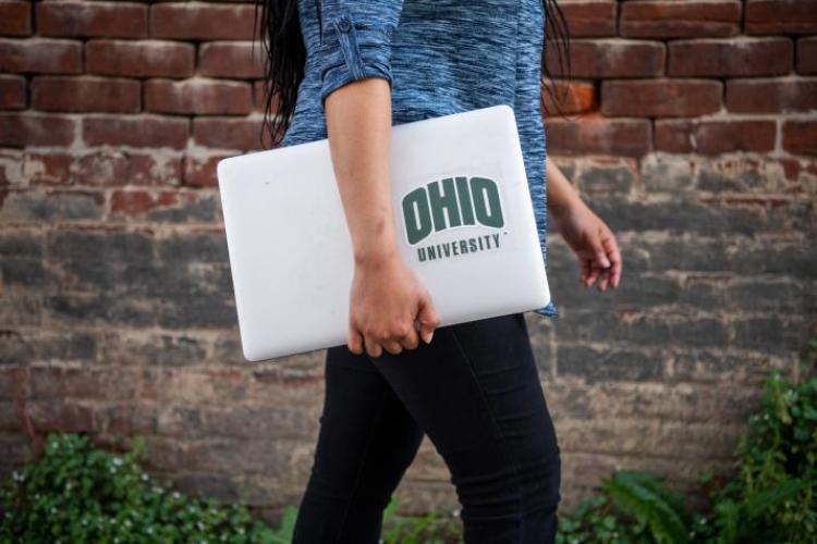Student carrying laptop