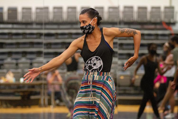 Visiting Artist Cara Hagan, works with first year dance students in a Modern 1 dance class