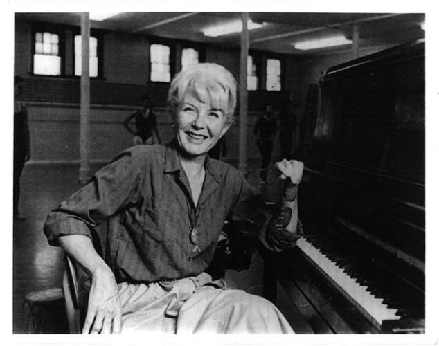 Betty Walberg in the studio at Ohio University with dancers behind her