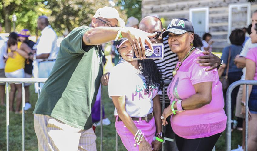 Three Bobcats pose for a photo at Tailgreat Park during Ohio University's 2019 Black Alumni Reunion.