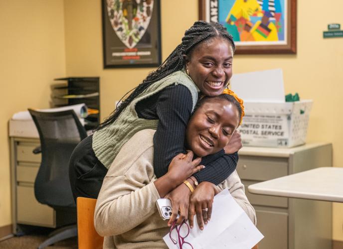 Vanessa Morgan-Nai is hugged by OHIO student Christine