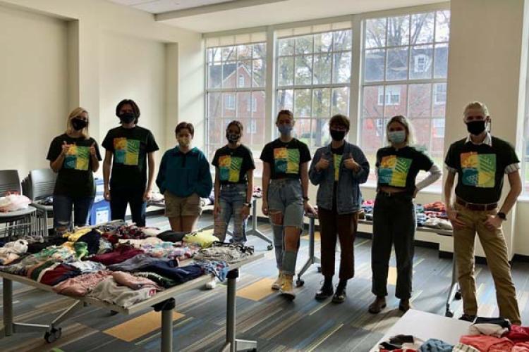 A group of Ambassadors facilitating a clothing swap in Jefferson Hall in 2021 during their annual outreach day.