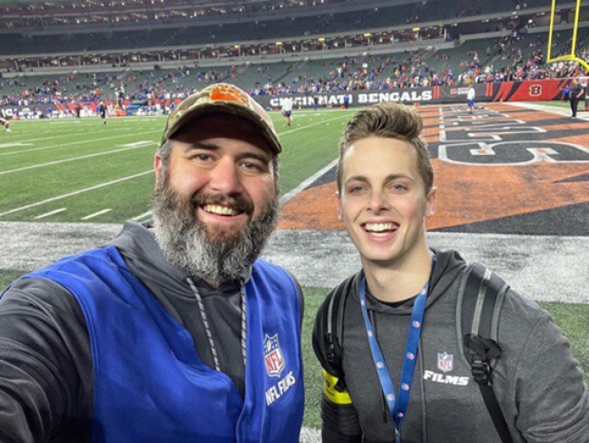 Evan Shaw and Jack Cowman are shown at an NFL game