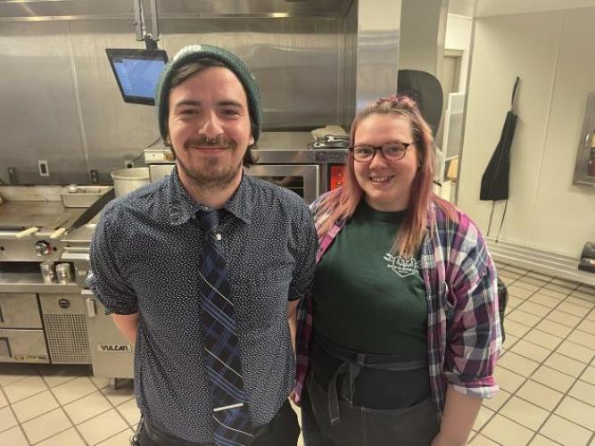 Two owners pose in Bob's Bobcat Bistro at Ohio University Lancaster.