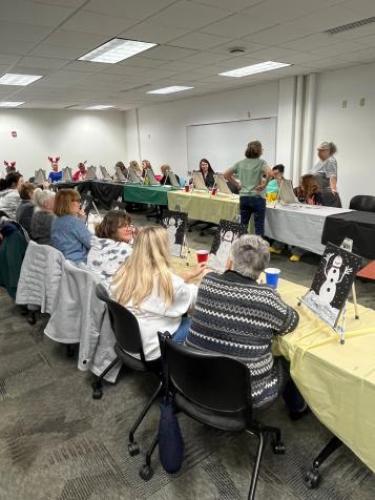 Participants in a community painting class