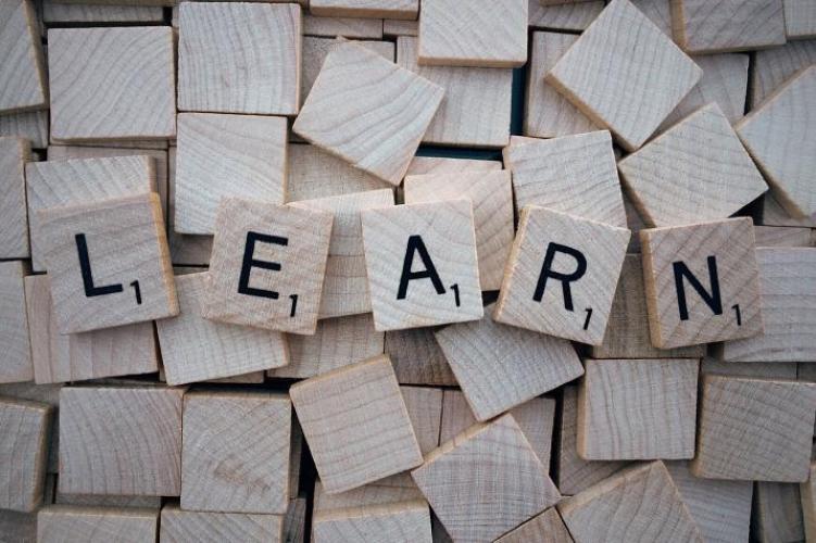 Scrabble blocks spelling out the word learn
