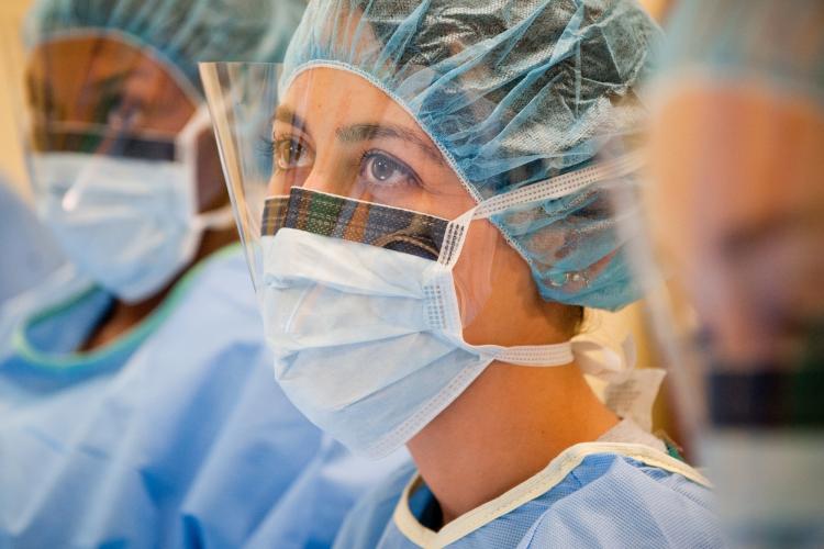 An OHIO student  wearing medical scrubs is shown in a medical setting