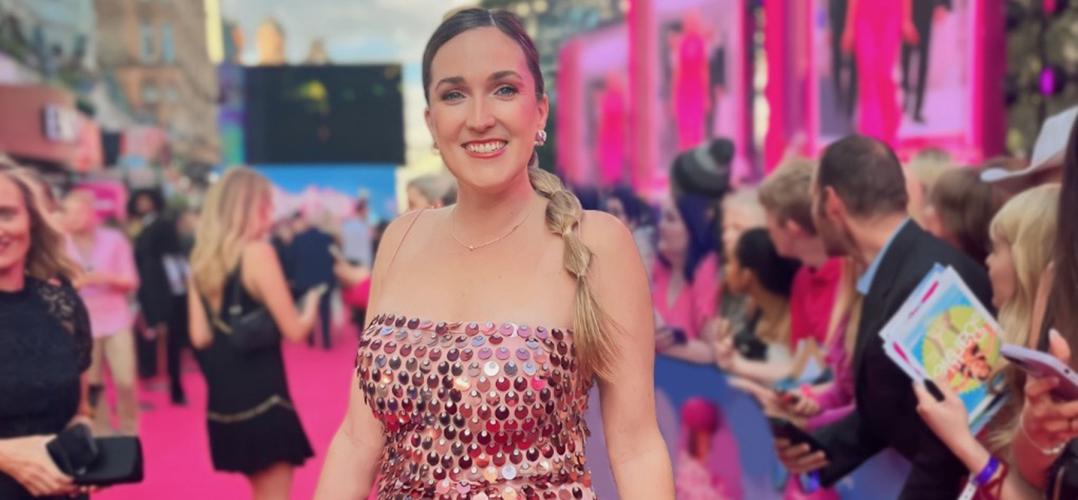 Kayla Carpenter on the pink carpet at the Barbie premiere in a pink sparkling gown