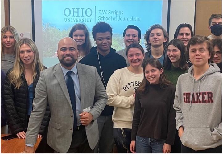 Steven Hernandez poses with a group of students