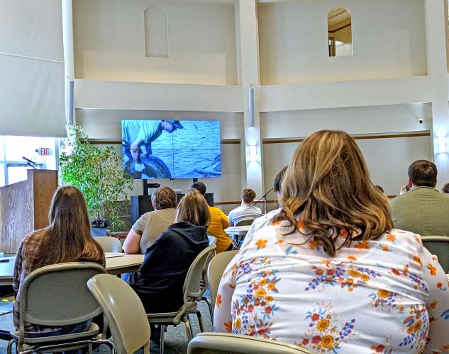 students watch film during media competition