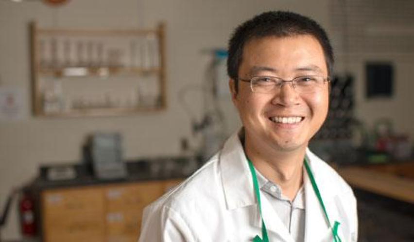 Professor Jixin Chen poses in a lab