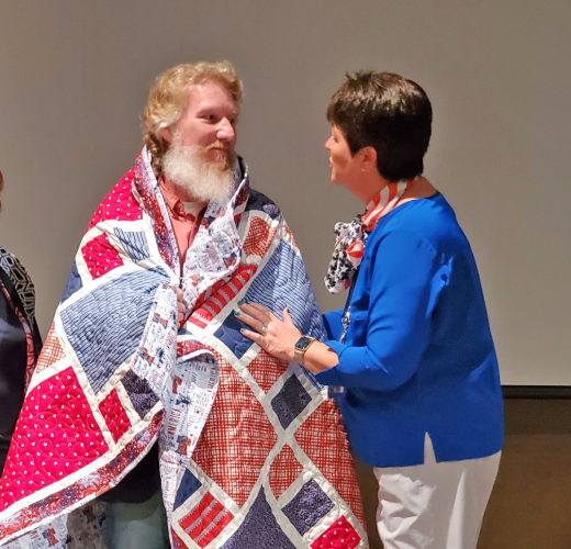 veteran accepting quilt of valor