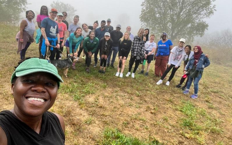 OHIO community members pose for a photo at the top of Radar Hill while on a hike