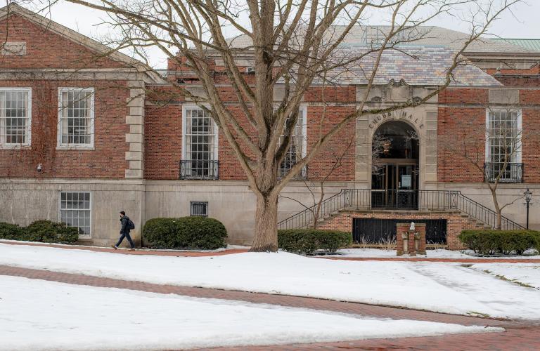 Chubb Hall and the College Green are shown on a snowy day in winter