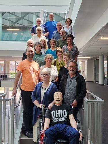 Standardized patients for the Heritage College of Osteopathic Medicine pose in Heritage Hall