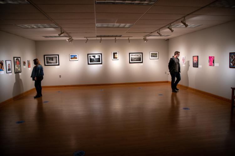 students look at art in the Patricia Scott Gallery 