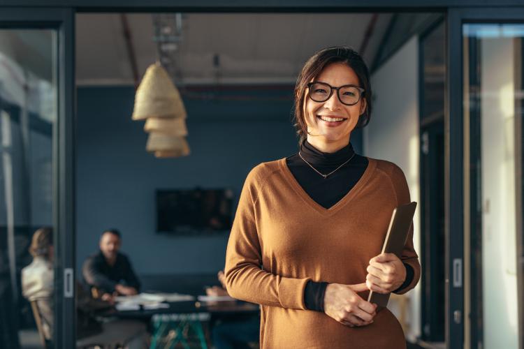 A business woman in casuals in office setting