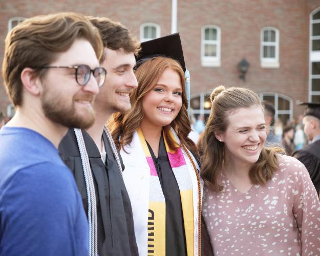 OHIO graduates smile with family and friends  at the Ohio University Southern Graduation Recognition Ceremony