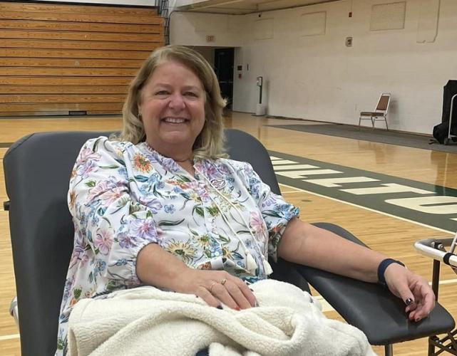 A professor prepares to donate blood at Shoemaker Center