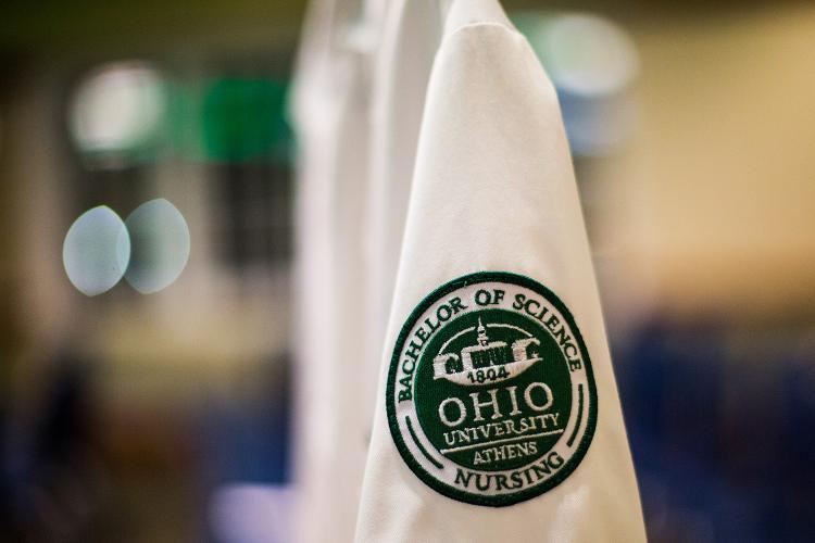 White nursing lab coat with OHIO nursing badge