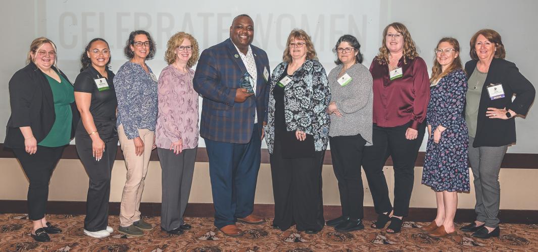 Members of the Celebrate Women committee stand together for a photo.