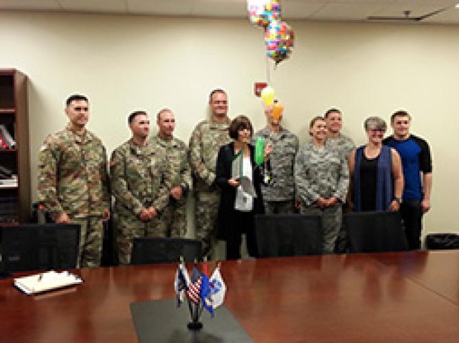 Ruth Bickle poses with Air Force and Army ROTC co-workers