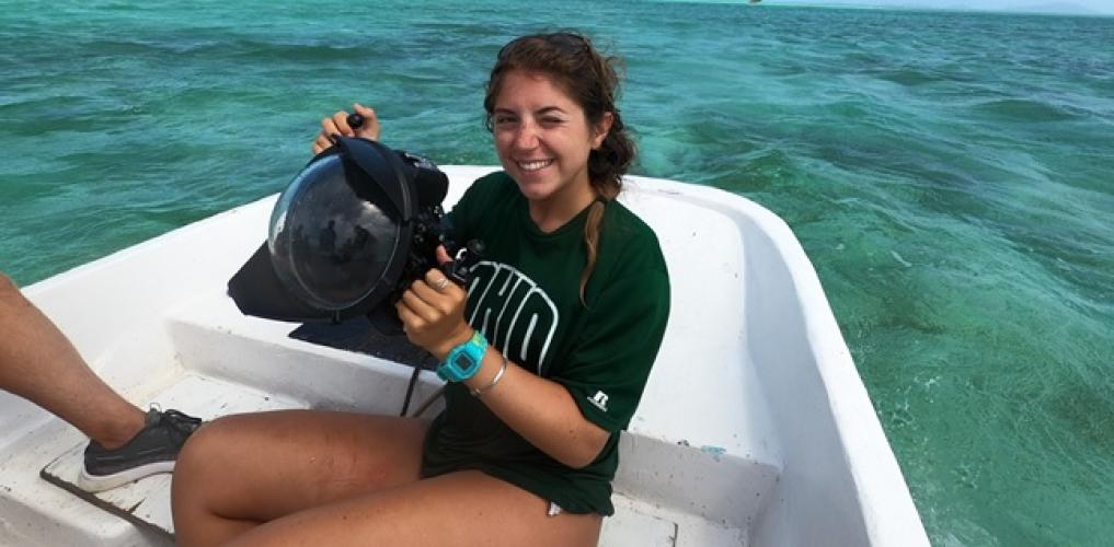 Alie Skowronski is shown in a boat out on the water