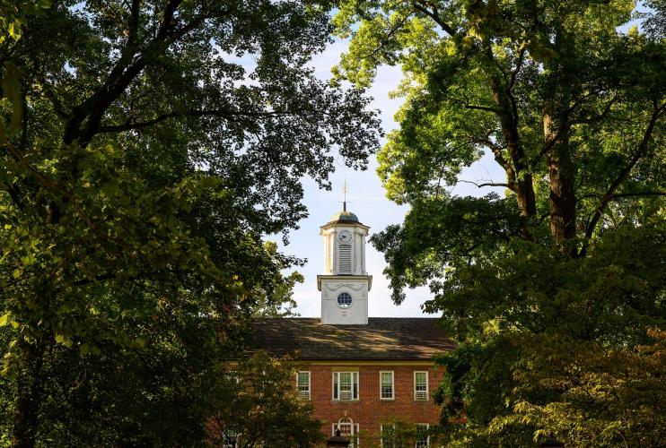 Cutler Hall is shown surrounded by trees