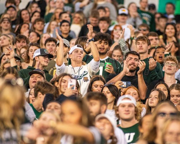 Bobcat fans cheer at a football game in Peden Stadium