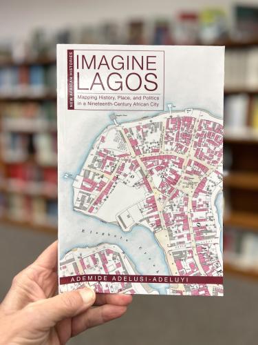 A photo of someone holding up the Imagine Lagos book