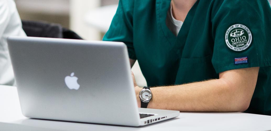 OHIO nursing student sitting with laptop 