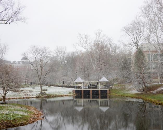 Emeriti Park is shown on a winter day with a dusting of snow in the trees on and the grass