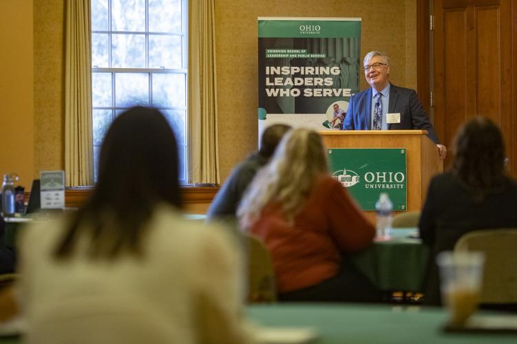 John Carey speaks at the GIS Symposium