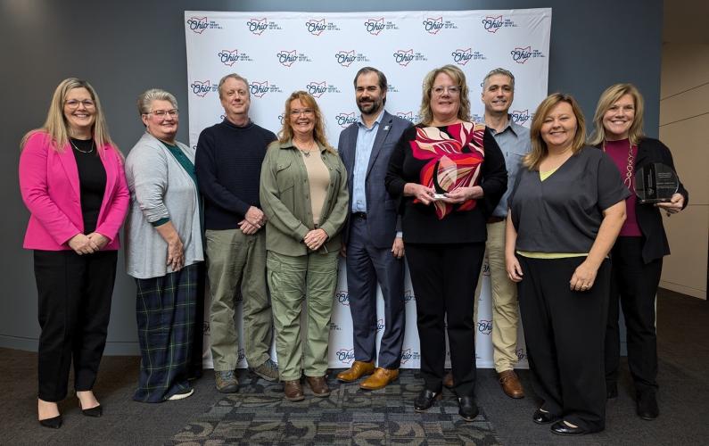 Representatives of the Small Business Development Center pose for a photo