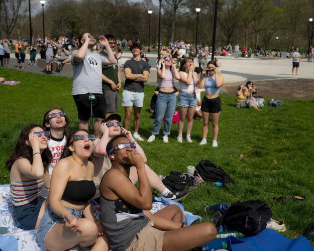 Students on the Ohio University campus watch the April 2024 solar eclipse