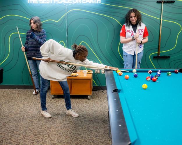 OHIO students play pool in the Bobcat HangOUt