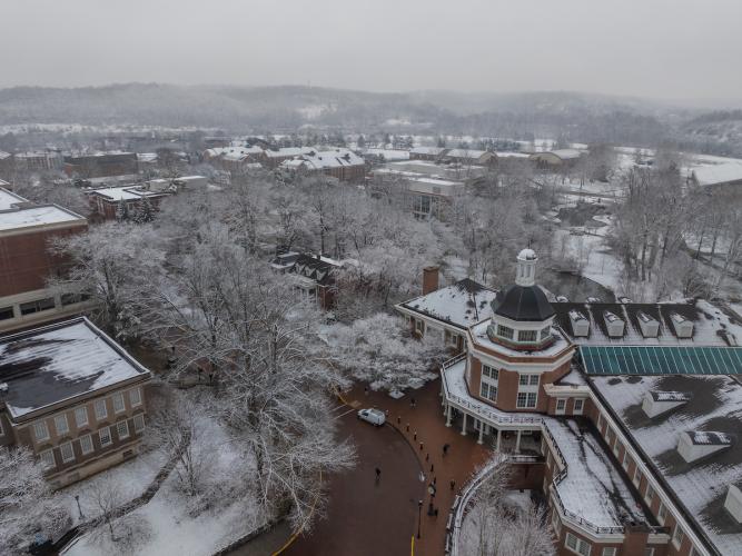 Baker University Center and the area around it is shown from above on a snowy winter day