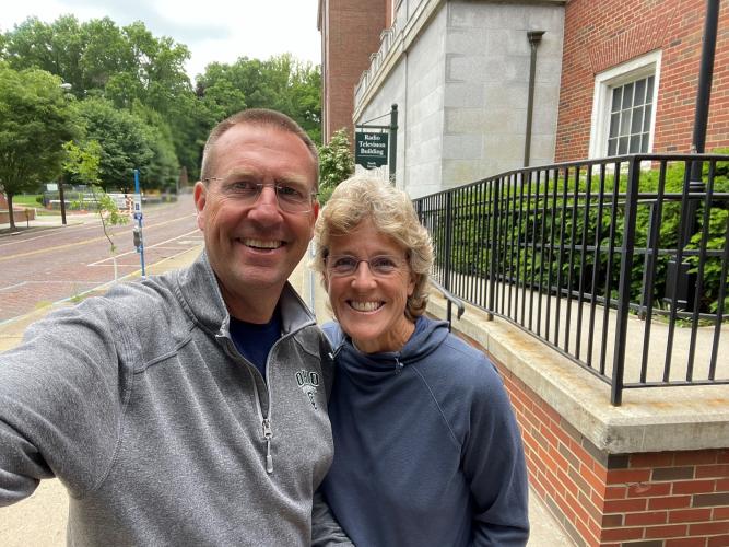 Charlie and Becky Kendall stand in front of RTV Building at Ohio University