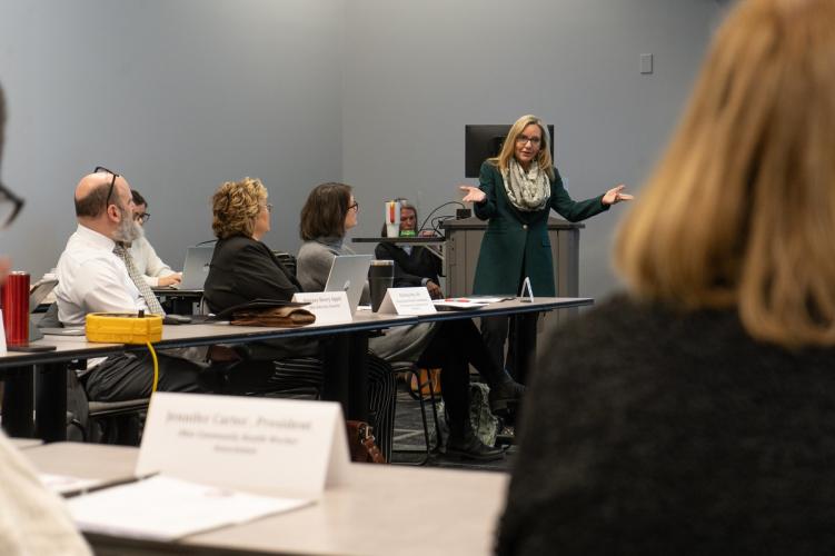 A representative from the Voinovich School gives a presentation to local health department officials