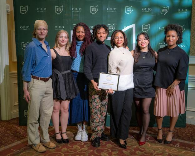 A group of OHIO students stands together and holds their award at the 2025 Leadership Awards event