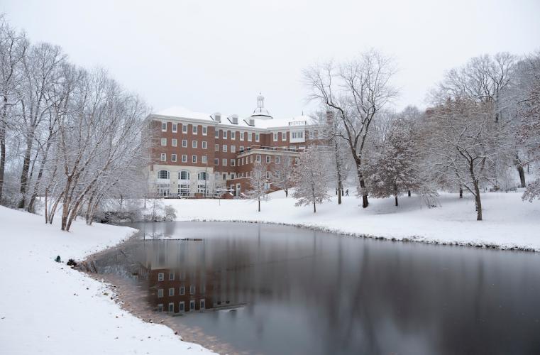 Baker University Center and the pond in front of it are shown on snowy day at Ohio University