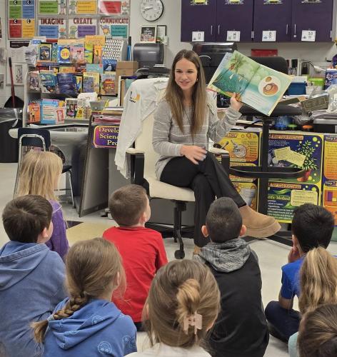 Ava Eldridge reads to students